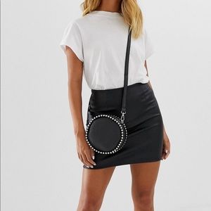 Leather look mini skirt